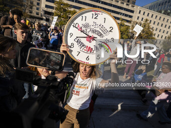 The women's march takes place in Washington, D.C., on November 2, 2024, where thousands of people gather at Freedom Plaza. Eight counter-pro...