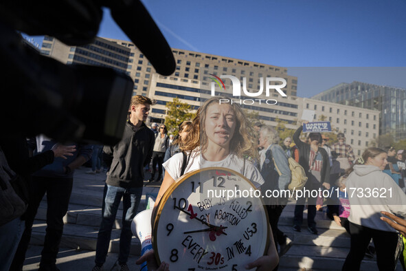 The women's march takes place in Washington, D.C., on November 2, 2024, where thousands of people gather at Freedom Plaza. Eight counter-pro...