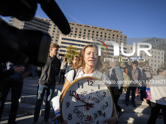 The women's march takes place in Washington, D.C., on November 2, 2024, where thousands of people gather at Freedom Plaza. Eight counter-pro...