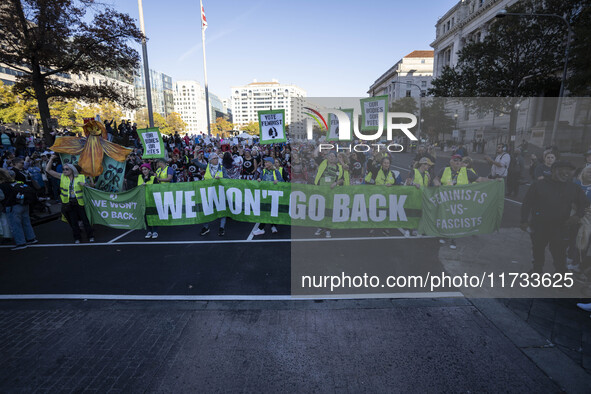 The women's march takes place in Washington, D.C., on November 2, 2024, where thousands of people gather at Freedom Plaza. Eight counter-pro...