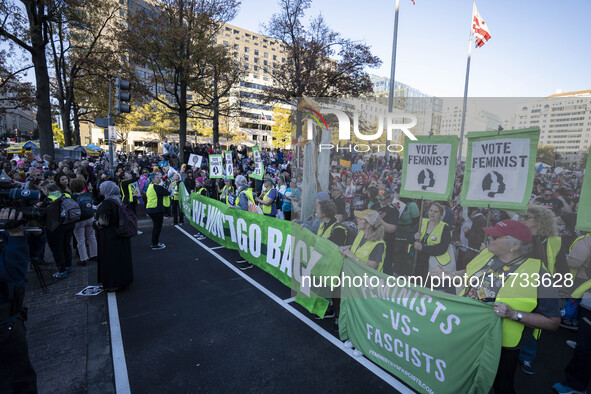 The women's march takes place in Washington, D.C., on November 2, 2024, where thousands of people gather at Freedom Plaza. Eight counter-pro...