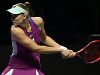 RIYADH, SAUDI ARABIA - NOVEMBER 02: Elena Rybakina of Kazakhstan in action during her match against Jasmine Paolini of Italy at the 2024 WTA...