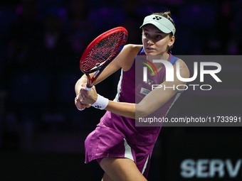 RIYADH, SAUDI ARABIA - NOVEMBER 02: Elena Rybakina of Kazakhstan in action during her match against Jasmine Paolini of Italy at the 2024 WTA...