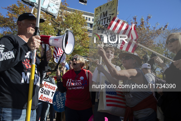 Abortion rights and anti-abortion rights activists protest together during the National Women's March at Freedom Plaza in Washington DC, USA...