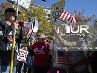 Abortion rights and anti-abortion rights activists protest together during the National Women's March at Freedom Plaza in Washington DC, USA...