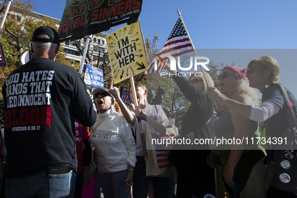 Abortion rights and anti-abortion rights activists protest together during the National Women's March at Freedom Plaza in Washington DC, USA...