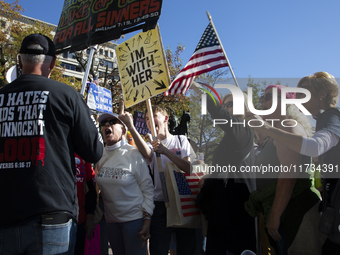 Abortion rights and anti-abortion rights activists protest together during the National Women's March at Freedom Plaza in Washington DC, USA...