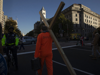 An anti-abortion rights activist carries a cross during the National Women's March in Washington DC, USA, on November 2, 2024. Just days bef...