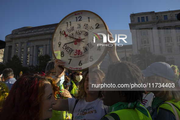 Anti-abortion rights activists protest during the National Women's March at Freedom Plaza in Washington DC, USA, on November 2, 2024. Just d...