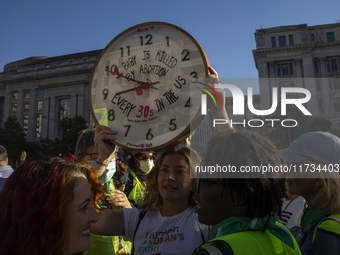 Anti-abortion rights activists protest during the National Women's March at Freedom Plaza in Washington DC, USA, on November 2, 2024. Just d...