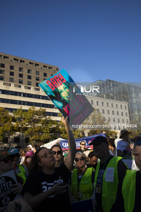 Anti-abortion rights activists protest during the National Women's March at Freedom Plaza in Washington DC, USA, on November 2, 2024. Just d...