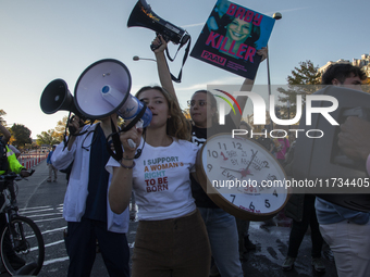 Anti-abortion rights activists protest during the National Women's March in Washington DC, USA, on November 2, 2024. Just days before the US...