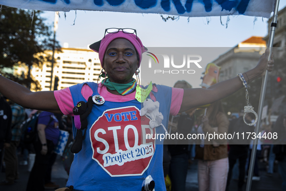 A demonstrator wears a shirt with the text ''Vote to stop Project 2025'' during the National Women's March in Washington DC, USA, on Novembe...