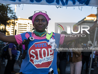 A demonstrator wears a shirt with the text ''Vote to stop Project 2025'' during the National Women's March in Washington DC, USA, on Novembe...