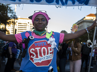 A demonstrator wears a shirt with the text ''Vote to stop Project 2025'' during the National Women's March in Washington DC, USA, on Novembe...