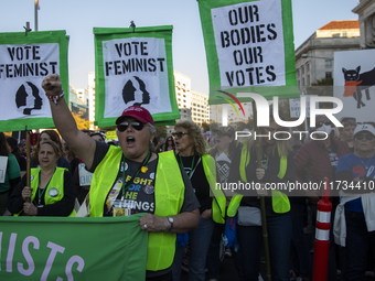 Demonstrators chant slogans during the National Women's March in Washington DC, USA, on November 2, 2024. Just days before the US Election,...