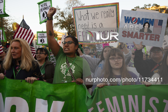 Demonstrators chant slogans during the National Women's March in Washington DC, USA, on November 2, 2024. Just days before the US Election,...