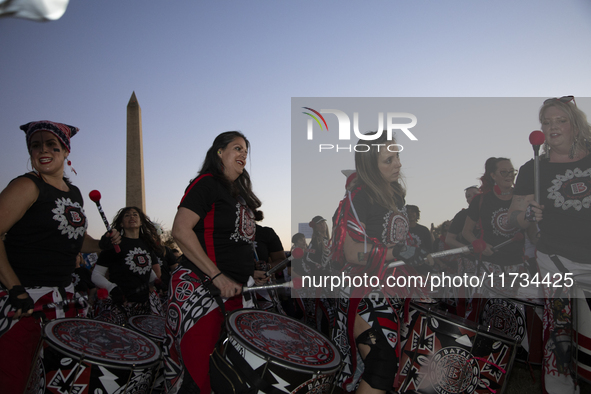 Drummers perform during the National Women's March in Washington DC, USA, on November 2, 2024. Just days before the US Election, thousands o...