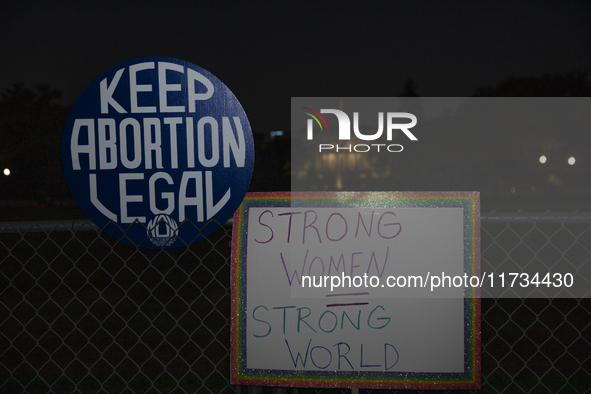 Several signs with text are displayed on the security fence of the White House during the National Women's March in Washington DC, USA, on N...