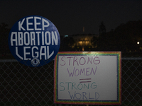 Several signs with text are displayed on the security fence of the White House during the National Women's March in Washington DC, USA, on N...