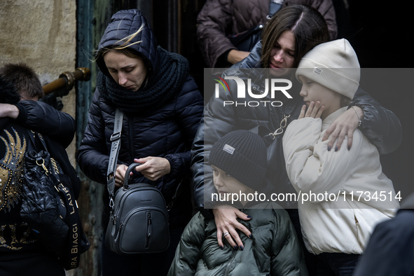 Relatives, friends, and comrades attend a funeral ceremony for Vasyl Mykytyshyn and Yuriy Pronyuk, who are killed at the front defending Ukr...