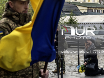 Relatives, friends, and comrades attend a funeral ceremony for Vasyl Mykytyshyn and Yuriy Pronyuk, who are killed at the front defending Ukr...