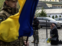 Relatives, friends, and comrades attend a funeral ceremony for Vasyl Mykytyshyn and Yuriy Pronyuk, who are killed at the front defending Ukr...