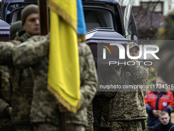 Relatives, friends, and comrades attend a funeral ceremony for Vasyl Mykytyshyn and Yuriy Pronyuk, who are killed at the front defending Ukr...