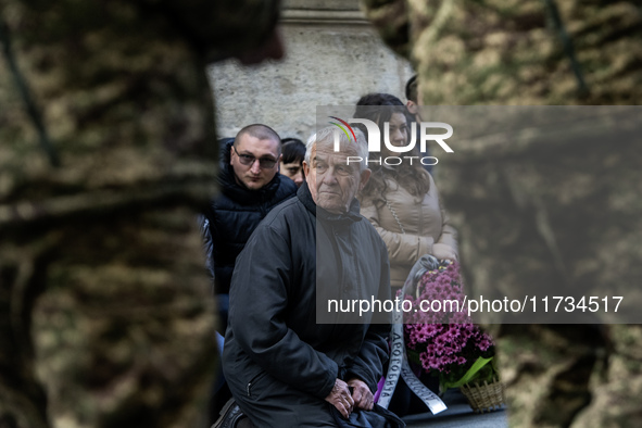 Relatives, friends, and comrades attend a funeral ceremony for Vasyl Mykytyshyn and Yuriy Pronyuk, who are killed at the front defending Ukr...