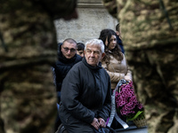 Relatives, friends, and comrades attend a funeral ceremony for Vasyl Mykytyshyn and Yuriy Pronyuk, who are killed at the front defending Ukr...