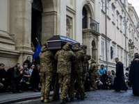 Relatives, friends, and comrades attend a funeral ceremony for Vasyl Mykytyshyn and Yuriy Pronyuk, who are killed at the front defending Ukr...