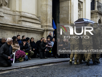 Relatives, friends, and comrades attend a funeral ceremony for Vasyl Mykytyshyn and Yuriy Pronyuk, who are killed at the front defending Ukr...