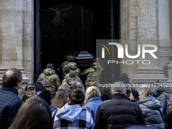 Relatives, friends, and comrades attend a funeral ceremony for Vasyl Mykytyshyn and Yuriy Pronyuk, who are killed at the front defending Ukr...