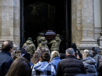 Relatives, friends, and comrades attend a funeral ceremony for Vasyl Mykytyshyn and Yuriy Pronyuk, who are killed at the front defending Ukr...