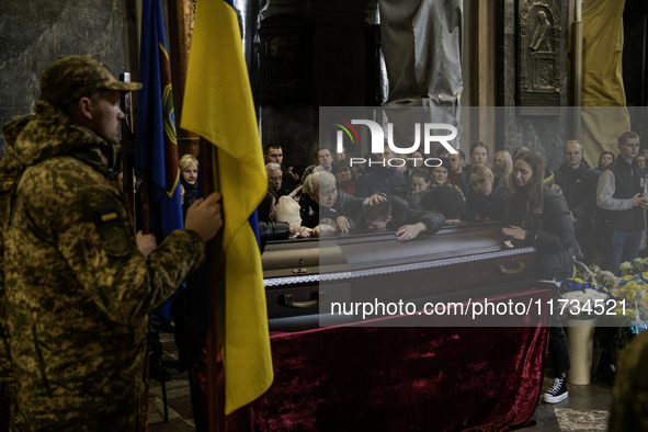 Relatives, friends, and comrades attend a funeral ceremony for Yuriy Pronyuk, who is killed at the front defending Ukraine against Russian o...