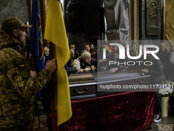 Relatives, friends, and comrades attend a funeral ceremony for Yuriy Pronyuk, who is killed at the front defending Ukraine against Russian o...