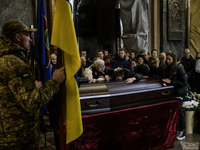 Relatives, friends, and comrades attend a funeral ceremony for Yuriy Pronyuk, who is killed at the front defending Ukraine against Russian o...