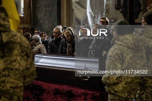 Relatives, friends, and comrades attend a funeral ceremony for Vasyl Mykytyshyn, who is killed at the front defending Ukraine against Russia...