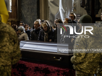 Relatives, friends, and comrades attend a funeral ceremony for Vasyl Mykytyshyn, who is killed at the front defending Ukraine against Russia...