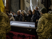 Relatives, friends, and comrades attend a funeral ceremony for Vasyl Mykytyshyn, who is killed at the front defending Ukraine against Russia...