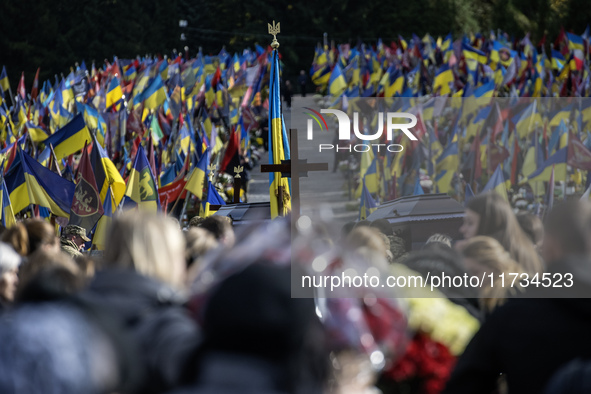 Relatives, friends, and comrades attend a funeral ceremony for Vasyl Mykytyshyn and Yuriy Pronyuk, who are killed at the front defending Ukr...