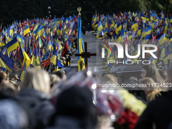 Relatives, friends, and comrades attend a funeral ceremony for Vasyl Mykytyshyn and Yuriy Pronyuk, who are killed at the front defending Ukr...