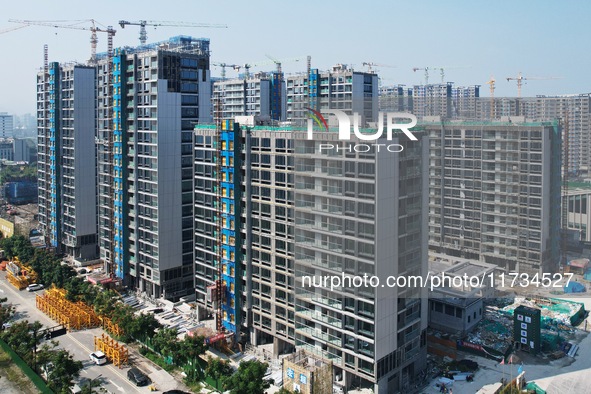 An aerial photo taken in Hangzhou, China, on November 3, 2024, shows a newly built commercial housing complex. According to the Ministry of...