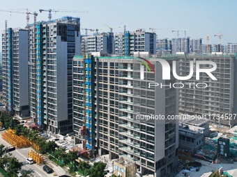 An aerial photo taken in Hangzhou, China, on November 3, 2024, shows a newly built commercial housing complex. According to the Ministry of...