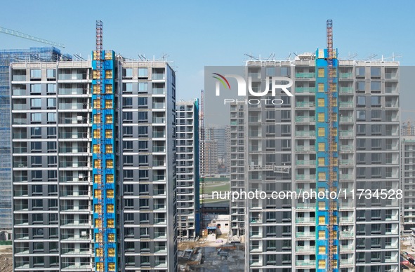 An aerial photo taken in Hangzhou, China, on November 3, 2024, shows a newly built commercial housing complex. According to the Ministry of...