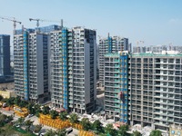 An aerial photo taken in Hangzhou, China, on November 3, 2024, shows a newly built commercial housing complex. According to the Ministry of...