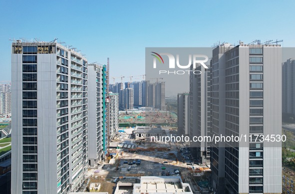 An aerial photo taken in Hangzhou, China, on November 3, 2024, shows a newly built commercial housing complex. According to the Ministry of...