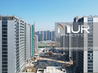 An aerial photo taken in Hangzhou, China, on November 3, 2024, shows a newly built commercial housing complex. According to the Ministry of...