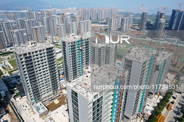 An aerial photo taken in Hangzhou, China, on November 3, 2024, shows a newly built commercial housing complex. According to the Ministry of...