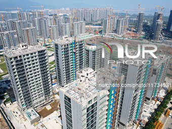 An aerial photo taken in Hangzhou, China, on November 3, 2024, shows a newly built commercial housing complex. According to the Ministry of...